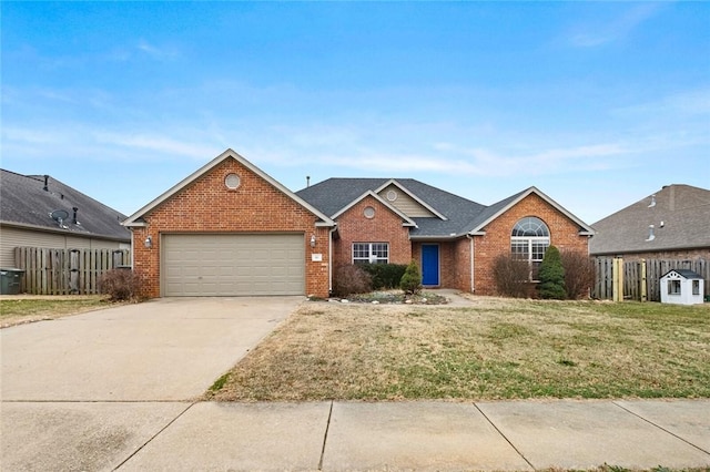 view of front of home featuring a front yard and a garage