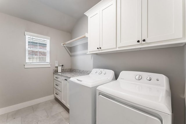 washroom with cabinets, light tile patterned flooring, and independent washer and dryer