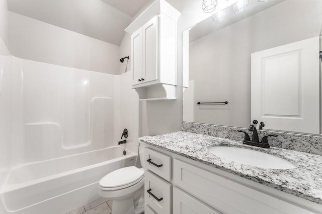 full bathroom with toilet, vanity, tile patterned floors, and bathtub / shower combination