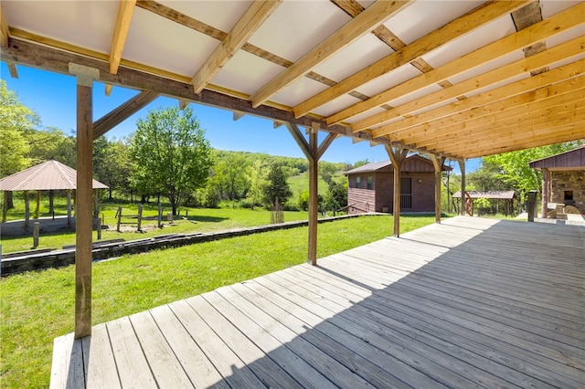 deck featuring a gazebo and a yard