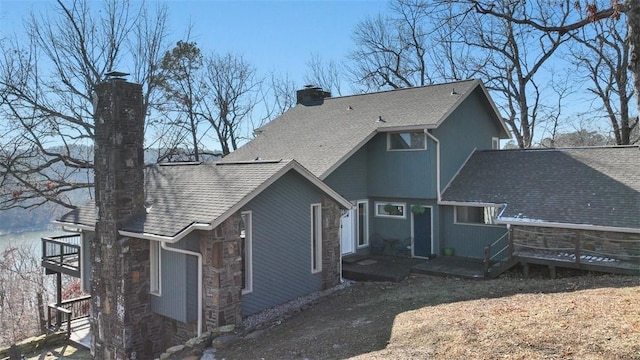 back of property featuring a balcony