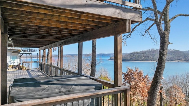 wooden deck with a water view