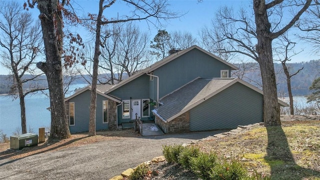 view of front of house featuring a water view