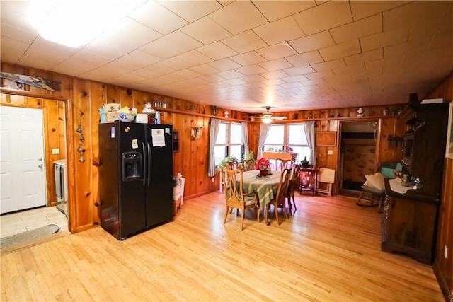 dining room featuring washer / clothes dryer, ceiling fan, and light hardwood / wood-style floors