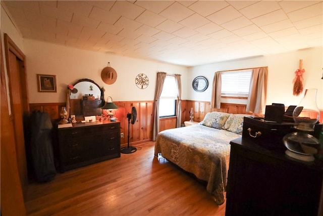 bedroom with hardwood / wood-style flooring