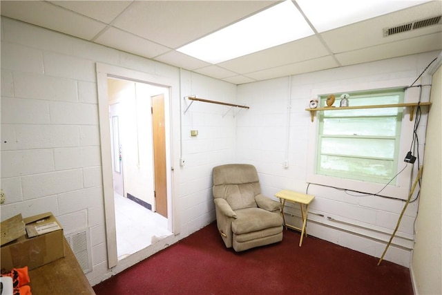 sitting room with a paneled ceiling