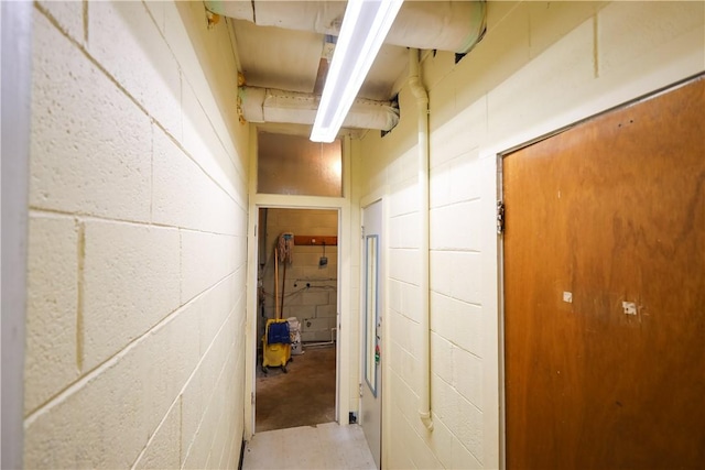 hallway with concrete floors