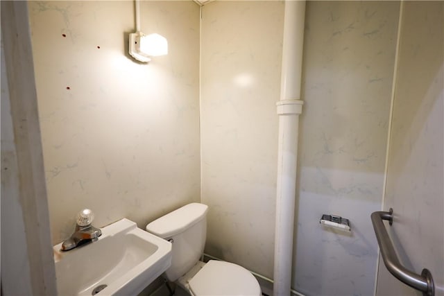 bathroom with sink and toilet