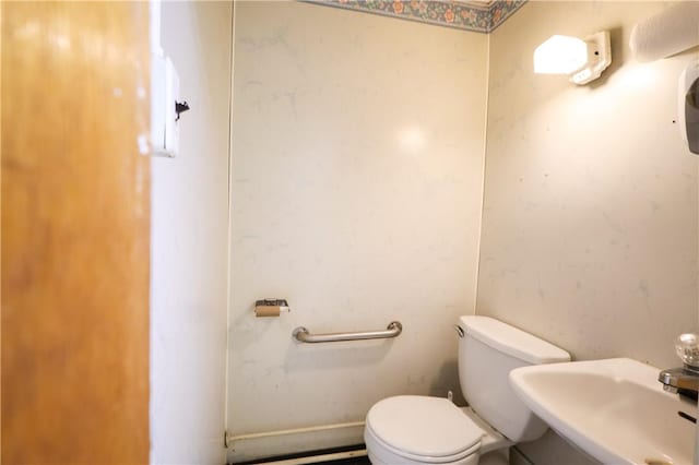 bathroom with sink and toilet