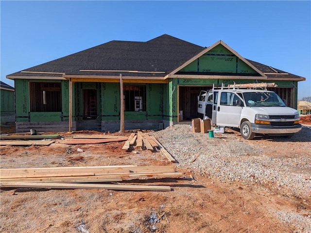 property under construction with a porch and a garage