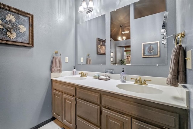 full bathroom with double vanity and a sink