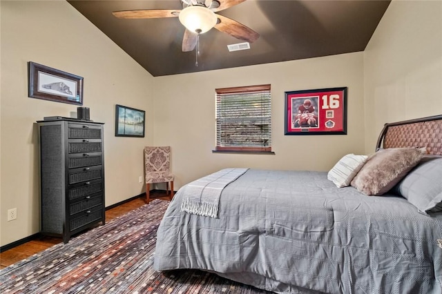 bedroom with a ceiling fan, wood finished floors, visible vents, and baseboards