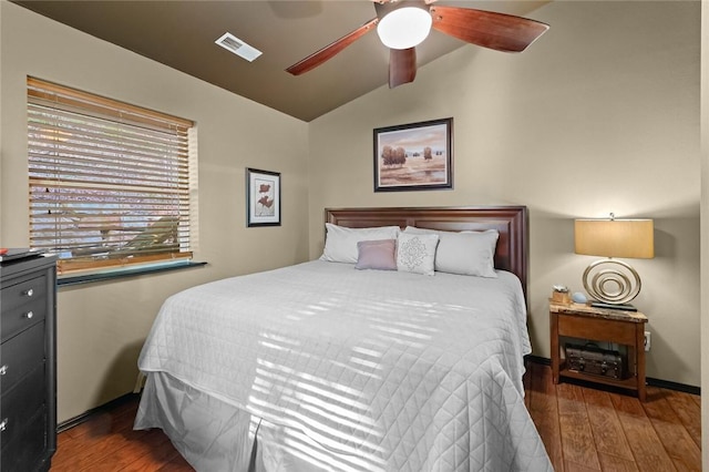 bedroom with wood-type flooring, visible vents, vaulted ceiling, and ceiling fan