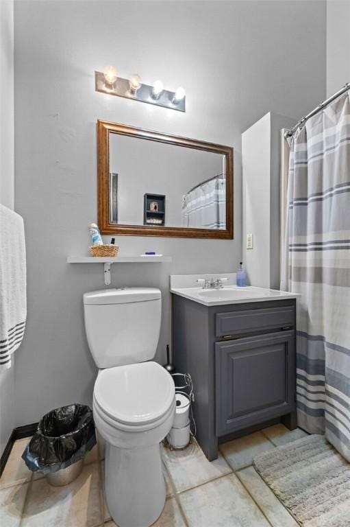 bathroom with toilet, a shower with curtain, tile patterned flooring, and vanity