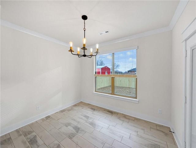 unfurnished room with a chandelier and crown molding