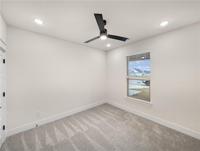 carpeted empty room with ceiling fan