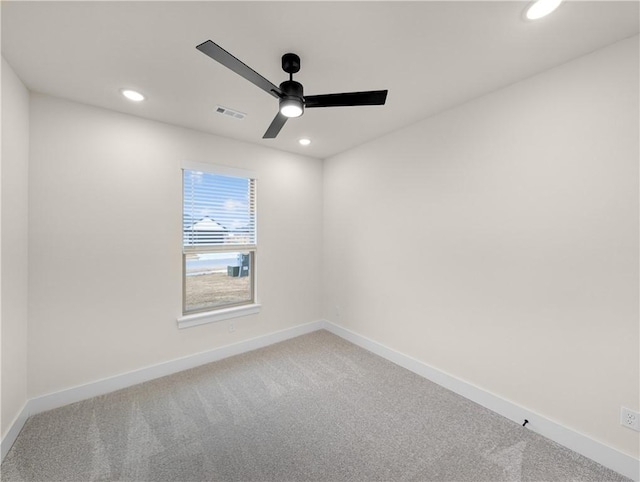 unfurnished room with ceiling fan and carpet flooring