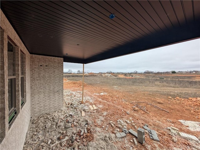 view of yard with a rural view