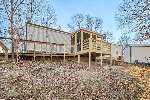 rear view of property with a wooden deck