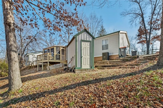 back of house featuring a deck