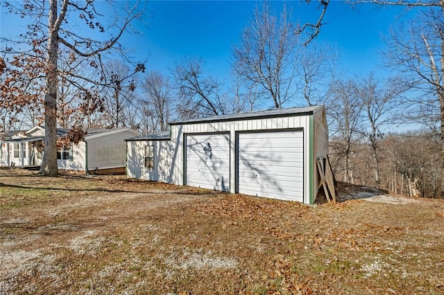 view of outdoor structure with a garage