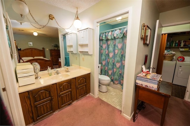 bathroom featuring vanity, a shower with curtain, toilet, a textured ceiling, and washing machine and clothes dryer