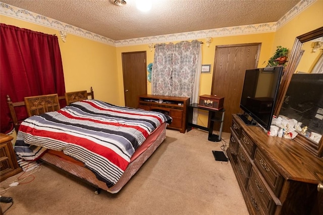 carpeted bedroom featuring a textured ceiling