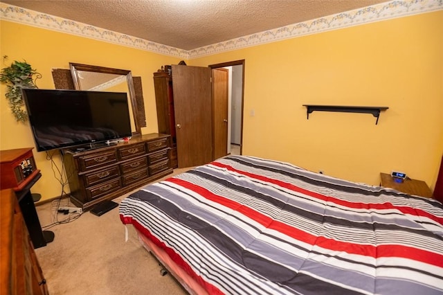 carpeted bedroom with a textured ceiling