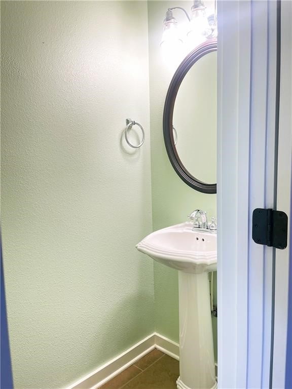 bathroom featuring tile patterned floors and sink