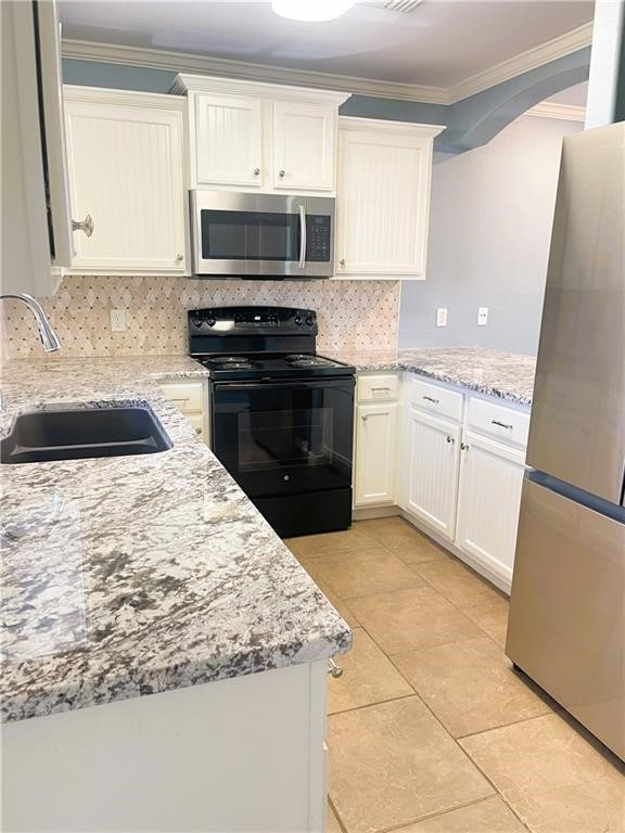 kitchen with white cabinetry, sink, crown molding, and appliances with stainless steel finishes