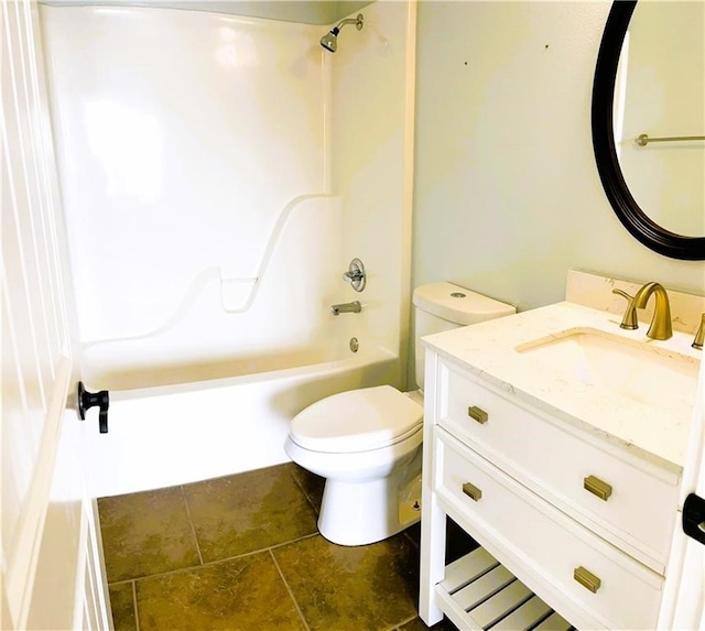 full bathroom featuring toilet, vanity, and tub / shower combination