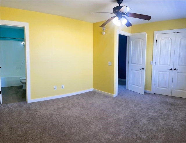 unfurnished bedroom featuring carpet floors, a closet, ceiling fan, and connected bathroom