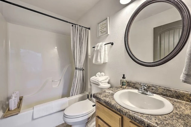 full bathroom with shower / bath combination with curtain, toilet, and vanity