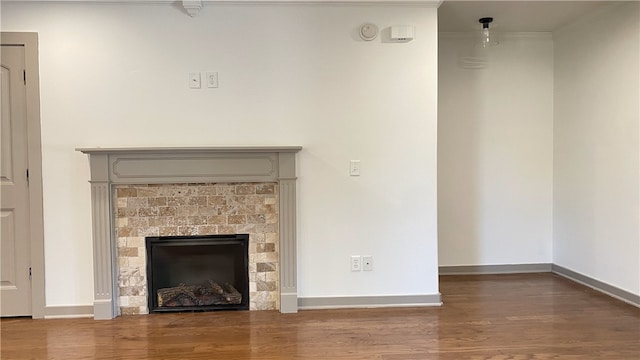 interior space with wood-type flooring and ornamental molding