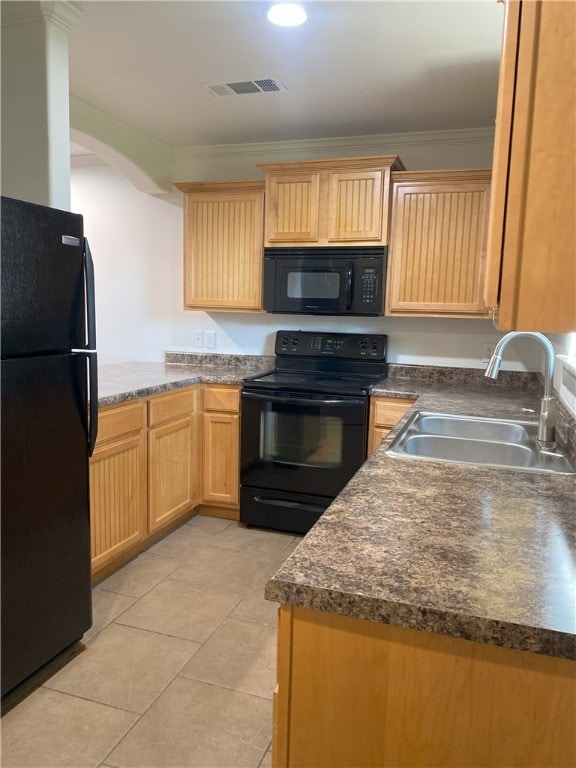 kitchen featuring crown molding, sink, black appliances, light tile patterned floors, and light brown cabinets