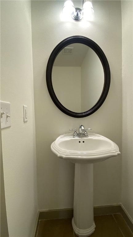 bathroom featuring tile patterned flooring and sink