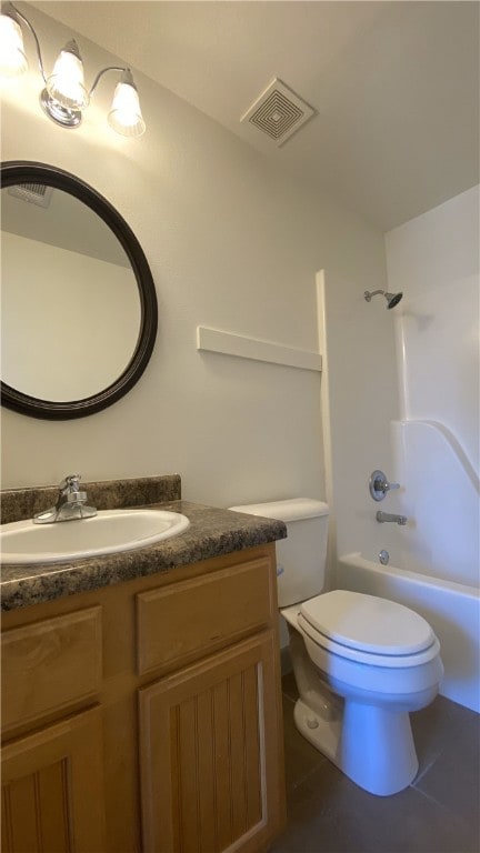 full bathroom featuring toilet, vanity, bathing tub / shower combination, and tile patterned flooring