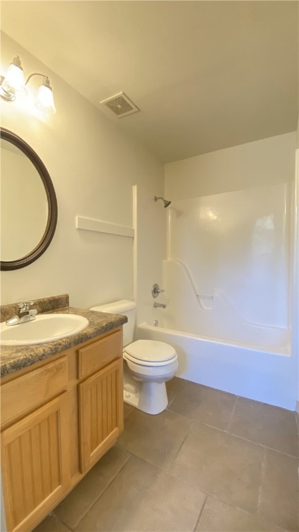 full bathroom featuring toilet, tile patterned flooring, vanity, and washtub / shower combination