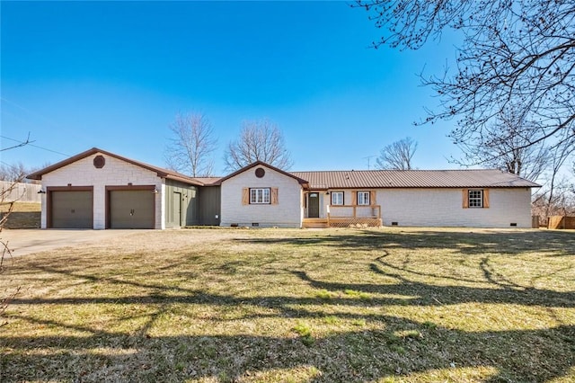 ranch-style home featuring a garage and a front yard