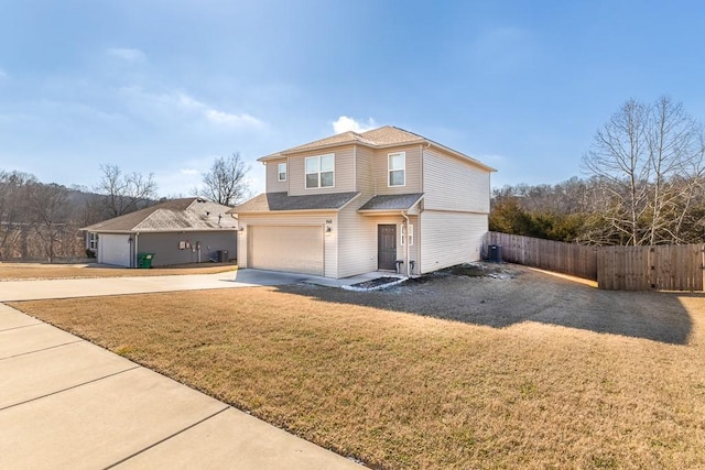 front facade featuring a garage and a front lawn