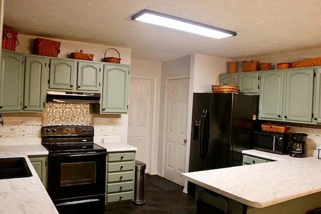 kitchen with kitchen peninsula, backsplash, black appliances, dark tile patterned flooring, and green cabinetry