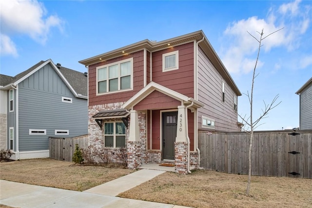 craftsman-style home with a front yard