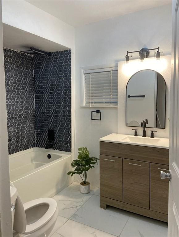 full bathroom featuring bathtub / shower combination, vanity, and toilet