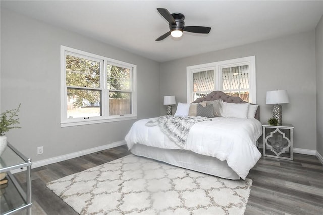 bedroom with ceiling fan and dark wood-type flooring