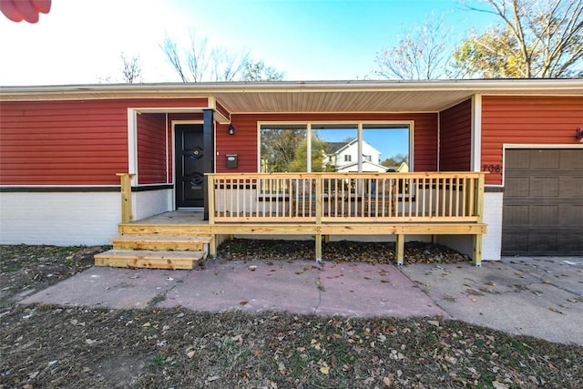 view of exterior entry with a garage