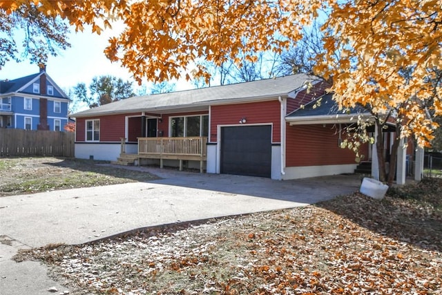 ranch-style home featuring a porch and a garage