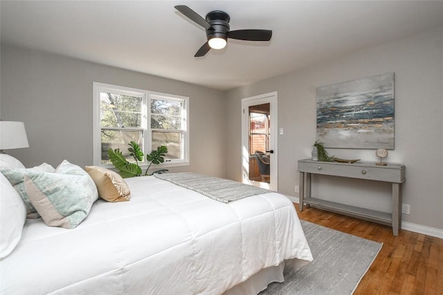 bedroom featuring hardwood / wood-style flooring and ceiling fan