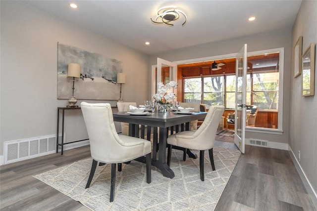 dining area with hardwood / wood-style floors