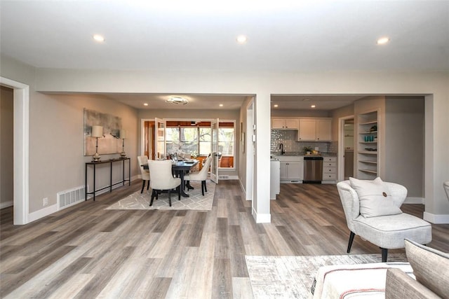 dining space featuring hardwood / wood-style floors