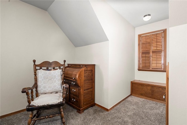 sitting room featuring light carpet and vaulted ceiling